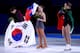 SOCHI, RUSSIA - FEBRUARY 20: (L-R) Silver medalist Yuna Kim of South Korea, gold medalist Adelina Sotnikova of Russia and bronze medalist Carolina Kostner of Italy celebrate during the flower ceremony for the Ladies' Figure Skating on day 13 of the Sochi