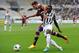 TURIN , ITALY - SEPTEMBER 29: Danilo D Ambrosio (L) of Torino FC competes with Kwadwo Asamoah of Juventus during the Serie A match between Torino FC and Juventus at Stadio Olimpico di Torino on September 29, 2013, in Turin, Italy. (Photo by Valerio Penn