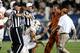 PROVO, UT - SEPTEMBER 7: Quarterback David Ash #14 of the Texas Longhorns is assisted by trainers after he was hurt on a play against the BYU Cougars during the second half of an NCAA football game September 7, 2013 at LaVell Edwards Stadium in Provo, Uta