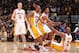 LOS ANGELES, CA - DECEMBER 8: Nick Young #0 and Jodie Meeks #20 help Kobe Bryant #24 of the Los Angeles Lakers up during a game against the Toronto Raptors on December 8, 2013 at STAPLES Center in Los Angeles, California. NOTE TO USER: User expressly ackn