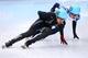 SOCHI, RUSSIA - FEBRUARY 21: J.R. Celski of the United States and Victor An of Russia compete in the Short Track Men's 5000m Relay Final A on day fourteen of the 2014 Sochi Winter Olympics at Iceberg Skating Palace on February 21, 2014 in Sochi, Russia.