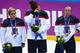 SOCHI, RUSSIA - FEBRUARY 20: (L-R) Silver medalists Brianna Decker #14, Anne Schleper #15 and Kelli Stack #16 of the United States react during the flower ceremony for the Ice Hockey Women's Gold Medal Game on day 13 of the Sochi 2014 Winter Olympics at