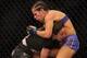 Sara McMann goes for the takedown against Sheila Gaff at UFC 159