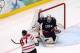 VANCOUVER, BC - FEBRUARY 28: Sidney Crosby #87 of Canada scores the game-winning goal in overtime against Ryan Miller #39 of USA in the ice hockey men's gold medal game between USA and Canada on day 17 of the Vancouver 2010 Winter Olympics at Canada Hoc