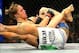 Feb 23, 2013; Anaheim, CA, USA; Ronda Rousey (black shorts) and Liz Carmouche (white shorts) fight during their UFC women's world bantamweight championship bout at the Honda Center. Mandatory Credit: Jayne Kamin-Oncea-USA TODAY Sports