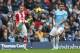 MANCHESTER, ENGLAND - FEBRUARY 22: Glenn Whelan of Stoke City shoots past Aleksandar Kolarov of Manchester City during the Barclays Premier League match between Manchester City and Stoke City at the Etihad Stadium on February 22, 2014 in Manchester, Engla