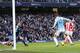 MANCHESTER, ENGLAND - FEBRUARY 22: Edin Dzeko of Manchester City misses a close range shot on goal as Stoke City keeper Asmir Begovic looks on during the Barclays Premier League match between Manchester City and Stoke City at the Etihad Stadium on Febru