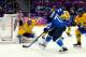 SOCHI, RUSSIA - FEBRUARY 21: Leo Komarov #71 of Finland brings the puck to the net against Henrik Lundqvist #30 of Sweden during the Men's Ice Hockey Semifinal Playoff on Day 14 of the 2014 Sochi Winter Olympics at Bolshoy Ice Dome on February 21, 2014 i