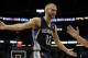 Feb 12, 2014; Orlando, FL, USA; Memphis Grizzlies shooting guard Nick Calathes (12) reacts to the referee against the Orlando Magic during the second half at Amway Center. Memphis Grizzlies defeated the Orlando Magic 86-81. Mandatory Credit: Kim Klement-U