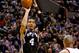 Feb 19, 2014; Portland, OR, USA; San Antonio Spurs shooting guard Danny Green (4) shoots against the Portland Trail Blazers during the fourth quarter at the Moda Center. Mandatory Credit: Craig Mitchelldyer-USA TODAY Sports
