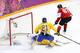 SOCHI, RUSSIA - FEBRUARY 23: Sidney Crosby #87 of Canada scores a goal against Henrik Lundqvist #30 of Sweden as Loui Eriksson #21 of Sweden looks on during the Men's Ice Hockey Gold Medal match on Day 16 of the 2014 Sochi Winter Olympics at Bolshoy Ice