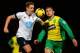 NORWICH, ENGLAND - FEBRUARY 23: Michael Dawson of Tottenham Hotspur and Gary Hooper of Norwich City compete for the ball during the Barclays Premier League match between Norwich City and Tottenham Hotspur at Carrow Road on February 23, 2014 in Norwich, En