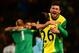 NORWICH, ENGLAND - FEBRUARY 23: Robert Snodgrass of Norwich City celebrates the 1-0 victory with Daniel Sanchez Ayala of Norwich City during the Barclays Premier League match between Norwich City and Tottenham Hotspur at Carrow Road on February 23, 2014