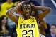 Feb 16, 2014; Ann Arbor, MI, USA; Michigan Wolverines guard Caris LeVert (23) reacts during the game against the Wisconsin Badgers at Crisler Arena. Mandatory Credit: Rick Osentoski-USA TODAY Sports