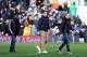 LONDON, ENGLAND - FEBRUARY 01: New signings (L-R) Larnell Cole, Kostas Mitroglou and John Heitinga of Fulham walk onto the pitch before the Barclays Premier League match between Fulham and Southampton at Craven Cottage on February 1, 2014 in London, Engl