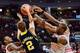 COLUMBUS, OH - FEBRUARY 11: Ohio State Buckeyes Sam Thompson #12, Shannon Scott #3 and LaQuinton Ross #10 converge to force Spike Albrecht #2 of the Michigan Wolverines to turn over the ball in the second half on February 11, 2014 at Value City Arena in