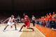 CHAMPAIGN, IL - FEBRUARY 15: Sam Thompson #12 of the Ohio State Buckeyes handles the ball while under pressure from Malcolm Hill #21 of the Illinois Fighting Illini as well as fans along the court during the game at State Farm Center on February 15, 2014