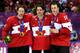 SOCHI, RUSSIA - FEBRUARY 23: (L-R) Duncan Keith #2, Patrick Sharp #10 and Jonathan Toews #16 of Canada pose with the gold medlas won during the Men's Ice Hockey Gold Medal match on Day 16 of the 2014 Sochi Winter Olympics at Bolshoy Ice Dome on February