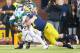 October 20, 2012; Ann Arbor, MI, USA; Michigan Wolverines linebacker Jake Ryan (47) forces a fumble by Michigan State Spartans running back Larry Caper (22) during the second half at Michigan Stadium. Michigan won 12-10. Mandatory Credit: Mike Carter-USA