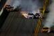 DAYTONA BEACH, FL - FEBRUARY 23: Joey Logano, driver of the #22 Shell-Pennzoil Ford, Carl Edwards, driver of the #99 Fastenal Ford, Kevin Harvick, driver of the #4 Budweiser Chevrolet, Reed Sorenson, driver of the #36 Golden Corral Chevrolet, and Kyle Bu