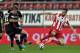 ATHENS,GREECE - FEBRUARY 5: Andreas Samaris of Olympiacos F.C. tackles Pavlos Mitropoulos of Panionios GSS during the Greek Superleague match between Olympiacos F.C. and Panionios GSS at the Karaiskaki Stadium on February 5, 2014 in Piraeus near Athens