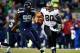 SEATTLE, WA - DECEMBER 02: Tight end Jimmy Graham #80 of the New Orleans Saints runs with the ball after a reception as defensive tackle Tony McDaniel #99 of the Seattle Seahawks defends during a game at CenturyLink Field on December 2, 2013 in Seattle, W