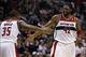 Jan 15, 2014; Washington, DC, USA; Washington Wizards power forward Nene (42) celebrates with Wizards power forward Trevor Booker (35) against the Miami Heat in the fourth quarter at Verizon Center. The Wizards won 114-97. Mandatory Credit: Geoff Burke-US