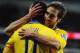 CARDIFF, WALES - NOVEMBER 30: Mathieu Flamini of Arsenal (R) celebrates with Mesut Oezil as he scores their second goal during the Barclays Premier League match between Cardiff City and Arsenal at Cardiff City Stadium on November 30, 2013 in Cardiff, Wal