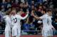 GETAFE, SPAIN - FEBRUARY 16: Luka Modric (L) of Real Madrid CF celebrates scoring their third goal with teammates Sergio Ramos (2ndL), Jese Rodriguez (3dL), Xabi Alonso (2ndR) and Gareth Bale (R) during the La Liga match between Getafe CF and Real Madrid