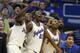LAWRENCE, KS - FEBRUARY 22: Joel Embiid #21, Andrew Wiggins #22 and members of the Kansas Jayhawks react to a dunk by Tarik Black of the Kansas Jayhawks during a game against the Texas Longhorns in the second half at Allen Fieldhouse on February 22, 2014