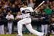 SEATTLE, WA - APRIL 16: Michael Morse of the Seattle Mariners hits an RBI single in the fourth inning against the Detroit Tigers at Safeco Field on April 16, 2013 in Seattle, Washington. All uniformed team members are wearing jersey number 42 in honor of