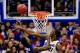 LAWRENCE, KS - JANUARY 11: Joel Embiid #21 of the Kansas Jayhawks blocks a shot by Jevon Thomas #5 of the Kansas State Wildcats during the game at Allen Fieldhouse on January 11, 2014 in Lawrence, Kansas. (Photo by Jamie Squire/Getty Images)