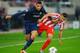 PIRAEUS, GREECE - FEBRUARY 25: Chris Smalling (L) of Manchester United holds off the challenge of Hernan Perez (R) of Olympiacos during the UEFA Champions League Round of 16 first leg match between Olympiacos FC and Manchester United at Karaiskakis Stadi