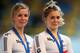 APELDOORN, NETHERLANDS - OCTOBER 18: Rebecca James (l) of Great Britain chats to team mate Jessica Varnish on the podium after finishing 3rd in the Women's Team Sprint Final during day one of the 2013 European Elite Track Championship at Omnisport Apeldo
