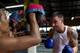 BANGKOK, THAILAND - AUGUST 11: Austrian tourist Stefan Steiner participates in a Muay Thai kickboxing class at the Sor. Vorapin kickboxing gym on August 11, 2011 in Bangkok, Thailand. The gym trains many foreigners looking for a challenge, trying out a n