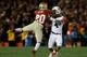 PASADENA, CA - JANUARY 06: Defensive back Lamarcus Joyner #20 of the Florida State Seminoles hits wide receiver Quan Bray #4 of the Auburn Tigers during the 2014 Vizio BCS National Championship Game at the Rose Bowl on January 6, 2014 in Pasadena, Califo