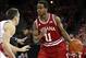 Feb 25, 2014; Madison, WI, USA; Indiana Hoosiers guard Yogi Ferrell (11) attempts to move the ball around Wisconsin Badgers guard Josh Gasser (right) during the first half at the Kohl Center. Mandatory Credit: Mary Langenfeld-USA TODAY Sports