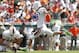 Sep 28, 2013; Tampa, FL, USA; Miami Hurricanes kicker Matt Goudis (18) kicks an extra point as punter Pat O'Donnell (16) holds the ball during the first half at Raymond James Stadium. Mandatory Credit: Kim Klement-USA TODAY Sports