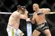 Dec 15, 2012; Las Vegas, NV, USA; Roy Nelson (left) is punched by Matt Mitrione (right) during their heavyweight bout in the Ultimate Fighter Finale at The Joint at the Hard Rock Hotel and Casino. Nelson won by KO. Mandatory Credit: Josh Holmberg-USA TODA