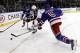 Jan 6, 2014; New York, NY, USA; Columbus Blue Jackets center Brandon Dubinsky (17) fights for the puck with New York Rangers defenseman Dan Girardi (5) during the first period at Madison Square Garden. Mandatory Credit: Adam Hunger-USA TODAY Sports