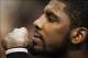Feb 18, 2014; Philadelphia, PA, USA; Cleveland Cavaliers guard Kyrie Irving (2) watches from the bench during the fourth quarter against the Philadelphia 76ers at the Wells Fargo Center. The Cavaliers defeated the Sixers 114-85. Mandatory Credit: Howard S