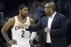 Feb 25, 2014; Cleveland, OH, USA; Cleveland Cavaliers head coach Mike Brown talks with point guard Kyrie Irving (2) against the Toronto Raptors during the fourth quarter at Quicken Loans Arena. The Raptors won 99-93. Mandatory Credit: Ron Schwane-USA TODA