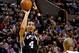 Feb 19, 2014; Portland, OR, USA; San Antonio Spurs shooting guard Danny Green (4) shoots against the Portland Trail Blazers during the fourth quarter at the Moda Center. Mandatory Credit: Craig Mitchelldyer-USA TODAY Sports
