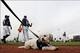 Feb 25, 2014; Maryvale, AZ, USA; Milwaukee Brewers take part in morning warm-ups at Maryvale Baseball Park, as the new team mascot, temporarily named Hank after Hank Aaron (not pictured) looks on. Mandatory Credit: Lance Iversen-USA TODAY Sports