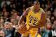 LOS ANGELES - FEBRUARY 4: Magic Johnson #32 of the Los Angeles Lakers dribbles the ball upcourt against the Utah Jazz during an NBA game at the Staples Center on February 4,1996 in Los Angeles, California. NOTE TO USER: User expressly acknowledges and a