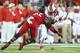 LOUISVILLE, KY - OCTOBER 10: Quron Pratt #7 of the Rutgers Scarlet Knights is tackled by Calvin Pryor #25 of the Louisville Cardinals during the game at Papa John's Cardinal Stadium on October 10, 2013 in Louisville, Kentucky. (Photo by Andy Lyons/Getty