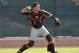 Feb 16, 2014; Scottsdale, AZ, USA; San Francisco Giants catcher Buster Posey (28) warms up during camp at Scottsdale Stadium. Mandatory Credit: Rick Scuteri-USA TODAY Sports