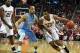 Feb 26, 2014; Raleigh, NC, USA; North Carolina State Wolfpack forward T.J. Warren (24) dribbles around North Carolina Tar Heels forward J.P. Tokoto (13) during the first half at PNC Arena. Mandatory Credit: Rob Kinnan-USA TODAY Sports