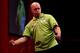 LONDON, ENGLAND - DECEMBER 30: Michael van Gerwen of The Netherlands celebrates victory after defeating Adrian Lewis of England in their semi final match on day fifteen of the Ladbrokes.com World Darts Championship at Alexandra Palace on December 30, 201