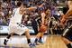 Feb 22, 2014; St. Louis, MO, USA; George Washington Colonials forward Kevin Larsen (21) passes the ball as Saint Louis Billikens forward Grandy Glaze (1) defends during the first half at Chaifetz Arena. Mandatory Credit: Scott Kane-USA TODAY Sports